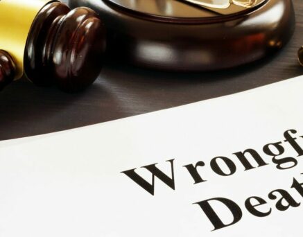 Wrongful Death report and gavel in a court.