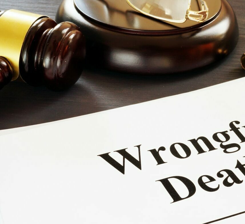 Wrongful Death report and gavel in a court.