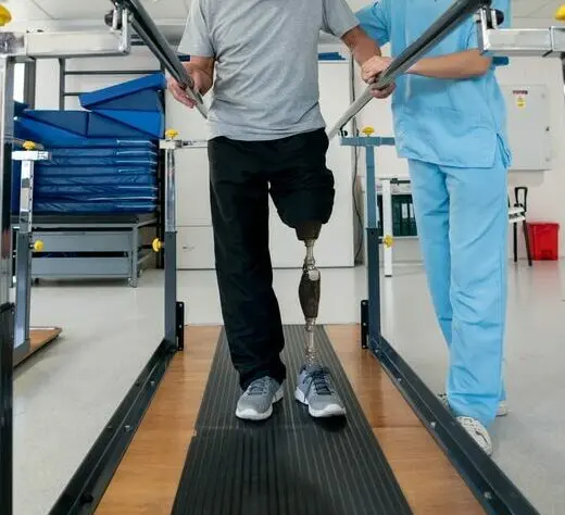 Disabled man wearing a prosthetic and doing physical therapy