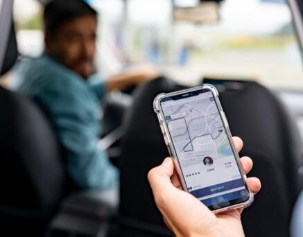 Man getting into a car he requested using a mobile app