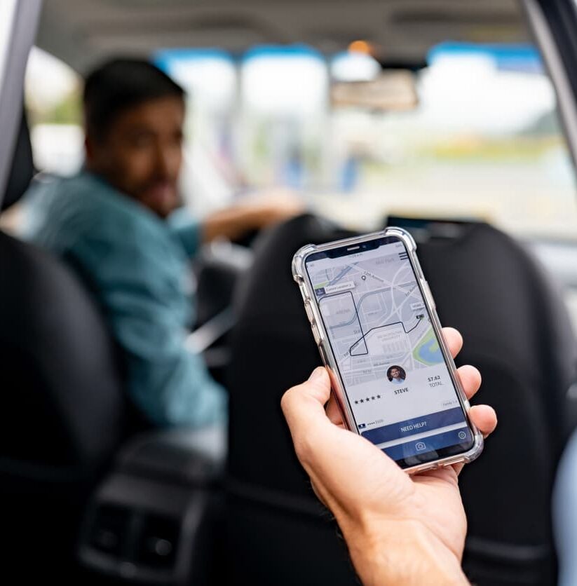 Man getting into a car he requested using a mobile app