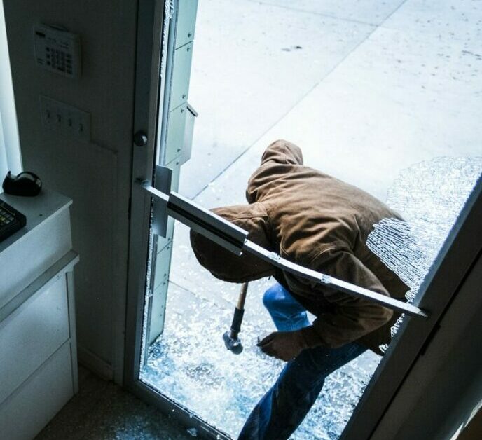 Robber using a sledgehammer,