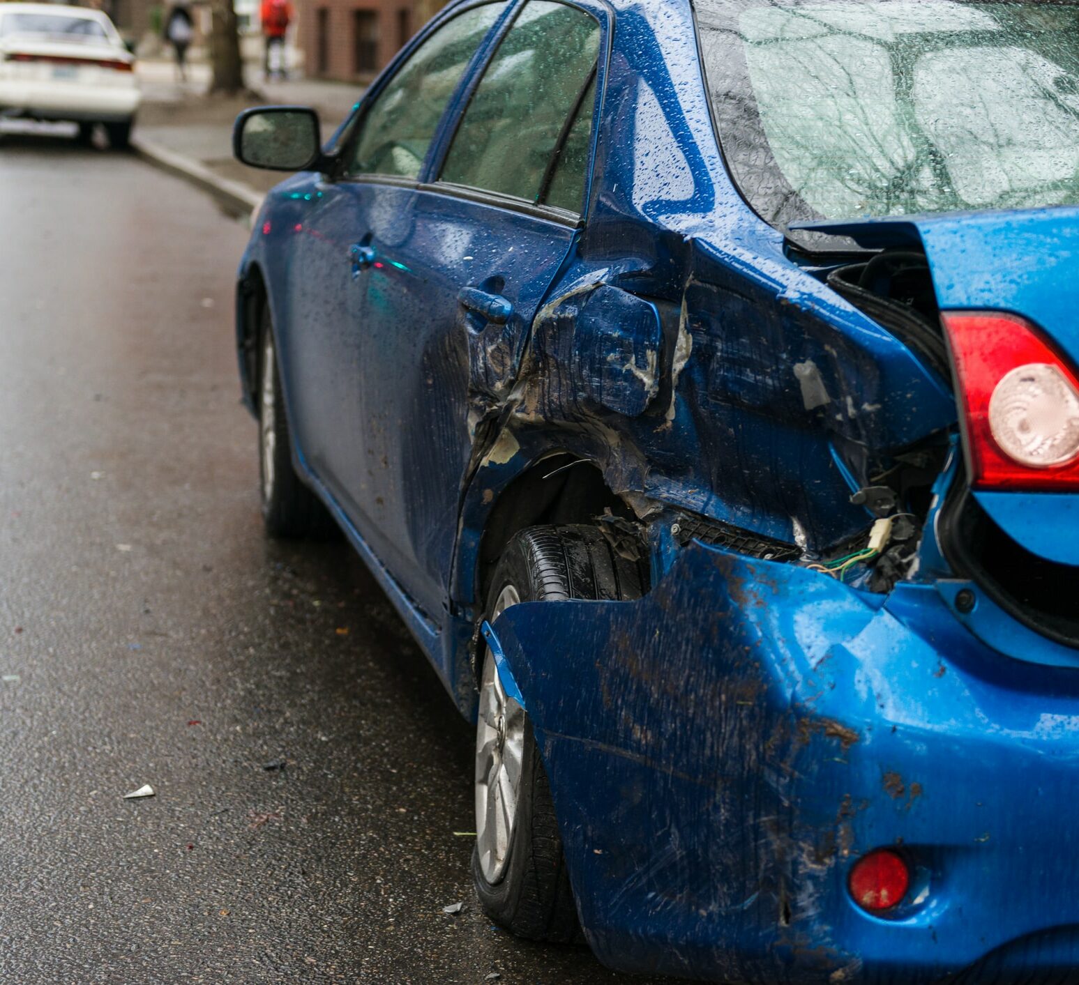 Hit and run involving a parked car on a city street.