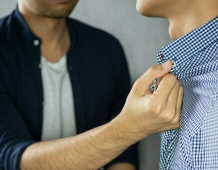 Man grab other by the collar, having argument
